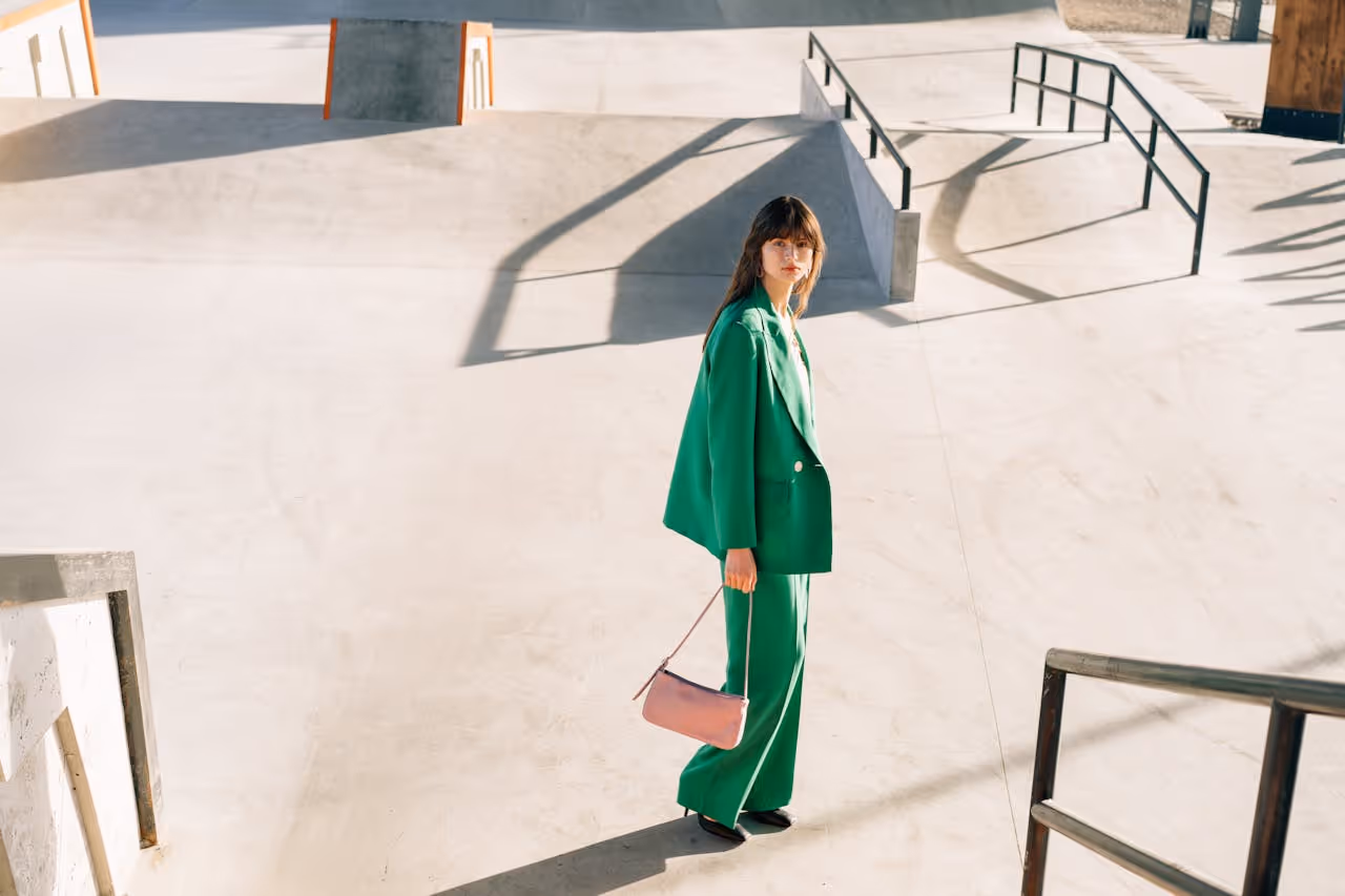 Image of a woman wearing a green suit.