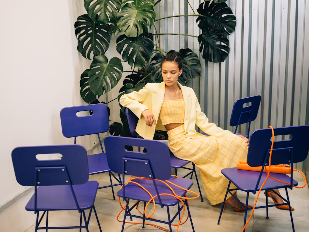 Image of a woman sitting in a chair.